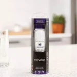 Retail packaging of Everydrop Filter 1 sitting on a white kitchen countertop, ready for installation in a bottom-freezer or side-by-side refrigerator.